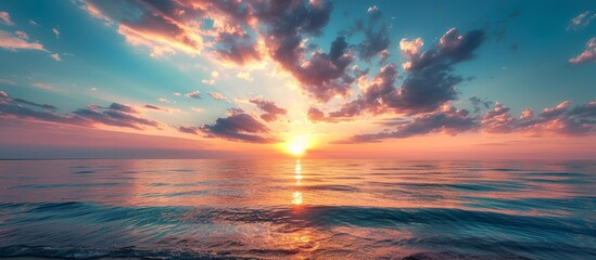 Wall Mural - the sun is setting over the ocean . High quality