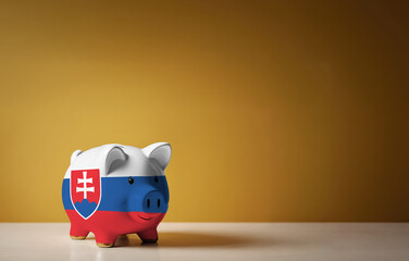 Wall Mural - Piggy bank with painting of Slovakia flag. The problem is in the economy. Economic crisis. Saving money concept.