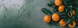Nature's palette, bright oranges adorned with leaves on a subdued backdrop, banner concept with space for copy or product