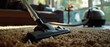 A vacuum cleaner head glides over a shaggy carpet, capturing the contrast of technology and home comfort in a warmly lit living room.