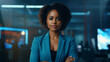 Portrait of confident african businesswoman on blue background