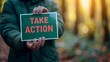 © Andrei - Motivational woman holding  believe in yourself  sign, symbolizing success on blurred background.