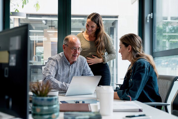 Family business, generational change. A father teaches his daughters the family business in the office. Generative AI.