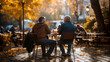 Two people sitting at a café table in autumn, representing conversation, friendship, relaxation and season change.