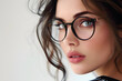 © Oksana - Closeup portrait of beautiful young woman wearing eyeglass isolated on white background