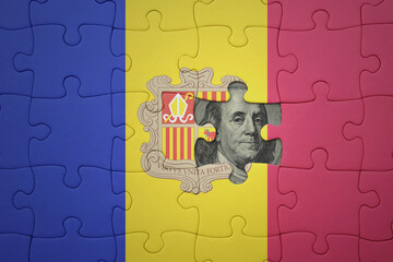 puzzle with the national flag of andorra and usa dollar banknote. finance concept