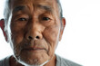 © Oksana - Closeup portrait of Asian senior man isolated on white background