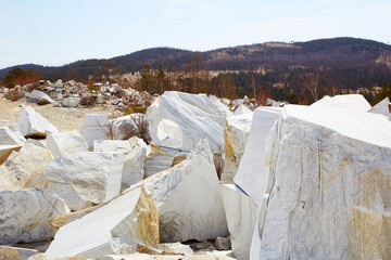 Large white marble blocks in an old abandoned quarry in the village of Buguldeika. Beautiful marble texture 