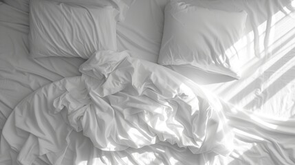 Sticker - a black and white photo of a bed with a white comforter on top of it and pillows on the bottom of the bed.