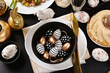 Top view of Easter table setting in black, white and golden colors