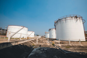 Tank farm in industry Thailand with white oil and petrol silos