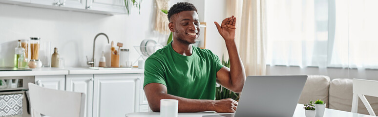 deaf african american freelancer using sign language for online communication on laptop, banner