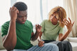 © LIGHTFIELD STUDIOS - serious conversation between an african american man and woman, couple having disagreement