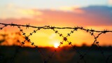 Macro view of a barbed wire against a sunset