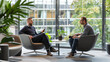 © Studio Zenith - deux hommes d'affaires discutant dans un bureau vitré donnant sur la ville