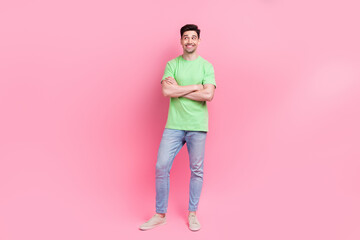 Sticker - Full body photo of man green t shirt folded hands confident business analytic looks stats empty space isolated on pink color background