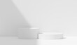 © Kakabe - podium background minimal product placement background with leaves shadow on white plaster wall. step pedestal . backdrop and mockup nature organic cosmetic products for sale shop online.3d rendering