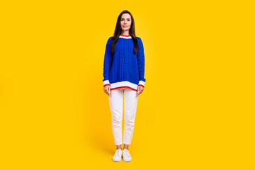 Sticker - Full body length photo of young woman brunette hair latin in blue knitted sweater with white pants isolated on yellow color background