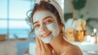 Attractive cheerful Smiling young woman applying face mask skin healthy and treatment therapy in fornt of bathroom mirror morning freshness lifestyle at home