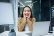 © Ivan - An excited young businesswoman or female office worker receives good news by getting a job promotion. feeling shocked and surprised.