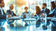 © MP Studio - business meeting in progress with participants seated around a reflective table, with a focus on their hands and the materials in front of them
