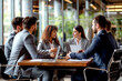 © ADDICTIVE STOCK - Diverse Group of People Sitting Around a Wooden Table at a Business Meeting Generative AI