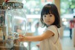 A little Japanese girl stands next to a water dispenser, ready to quench her thirst.