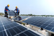 © ultramansk - Male workers repair Floating solar panels on water lake. Engineers construct on site Floating solar panels at sun light. clean energy for future living. Industrial Renewable energy of green power.