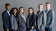 © MP Studio - diverse group of business professionals smiling and posing for a group photo, likely representing a collaborative and inclusive corporate team.