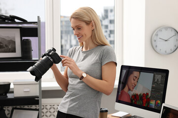 Canvas Print - Professional photographer with modern digital camera in office