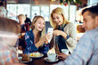 © Davor - Happy family enjoying time together at a cafe
