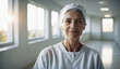 © EliteLensCraftImages - Confident Old Spanish Female Doctor or Nurse in Clinic Outfit Standing in Modern White Hospital, Looking at Camera, Professional Medical Portrait, Copy Space, Design Template, Healthcare Concept