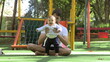 © Marco - Casual father playing with baby son at playground park