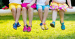 © famveldman - Kids with colorful shoes. Children footwear