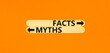 Facts or myths symbol. Concept word Myths and Facts on beautiful wooden stick. Beautiful orange table orange background. Business and facts or myths fact myth concept. Copy space.