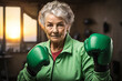 Grandmother wearing green boxing gloves, strong and determined, positive and dynamic, showing fists, ready to fight . Active senior lifestyle concept