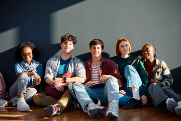 Wall Mural - Multiracial group of happy college students looking at camera.