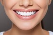 © Serhii - Healthy Teeth and Confident Smile of a Young Woman. Dental Care and Whitening Concept on White