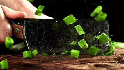 Sticker - A cook chops green onions. Filmed on a high-speed camera at 1000 fps. High quality FullHD footage