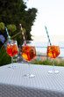 Three aperol spritz on a summer evening in a mediterranean pub