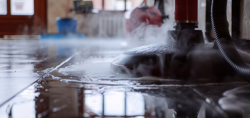 Wall Mural - A person operating a steam machine on a clean and shiny tiled floor. Ideal for showcasing the use of steam cleaning equipment.