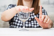 Woman Refusing Glass of Water Signifying No Drinking