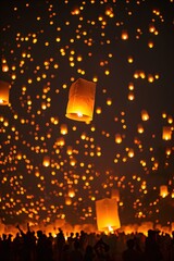 Wall Mural - a group of people flying paper lanterns in the night sky