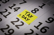 © B_V_PHOTOGRAPHY - Red tack in calendar pointing at April 15th 2024, Tax Day in the USA for 2023 earnings. High quality photo