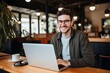 © Nia™ - Beautiful young man happily smiling while working with laptop in office - generative ai