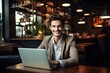 © Nia™ - Beautiful young man happily smiling while working with laptop in office - generative ai