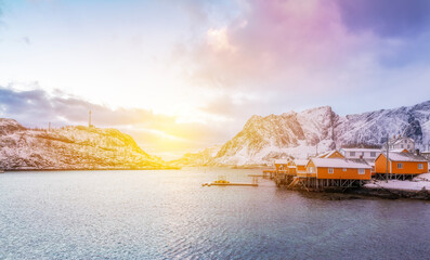 Wall Mural - norway lofoten beach red houses clouds in the air sunset light and colors