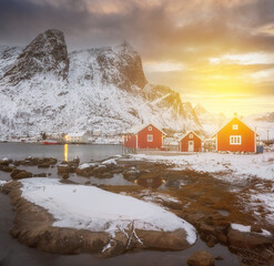 Wall Mural - norway lofoten beach red houses clouds in the air sunset light and colors