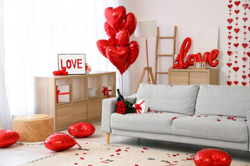 Poster - Bottle of wine with roses and gift on sofa at decorated home for Valentine's Day celebration