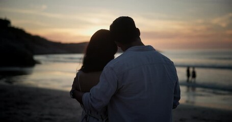 Wall Mural - Sunset, back and couple at beach for love on holiday, travel or summer vacation on valentines day date. Rear view, man and woman at ocean together for connection, hug and relationship at sea outdoor